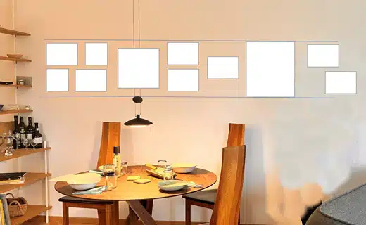 Zur Vervollständigung der Bilderwand werden mehrere weiße Rechtecke an der Wand platziert. 